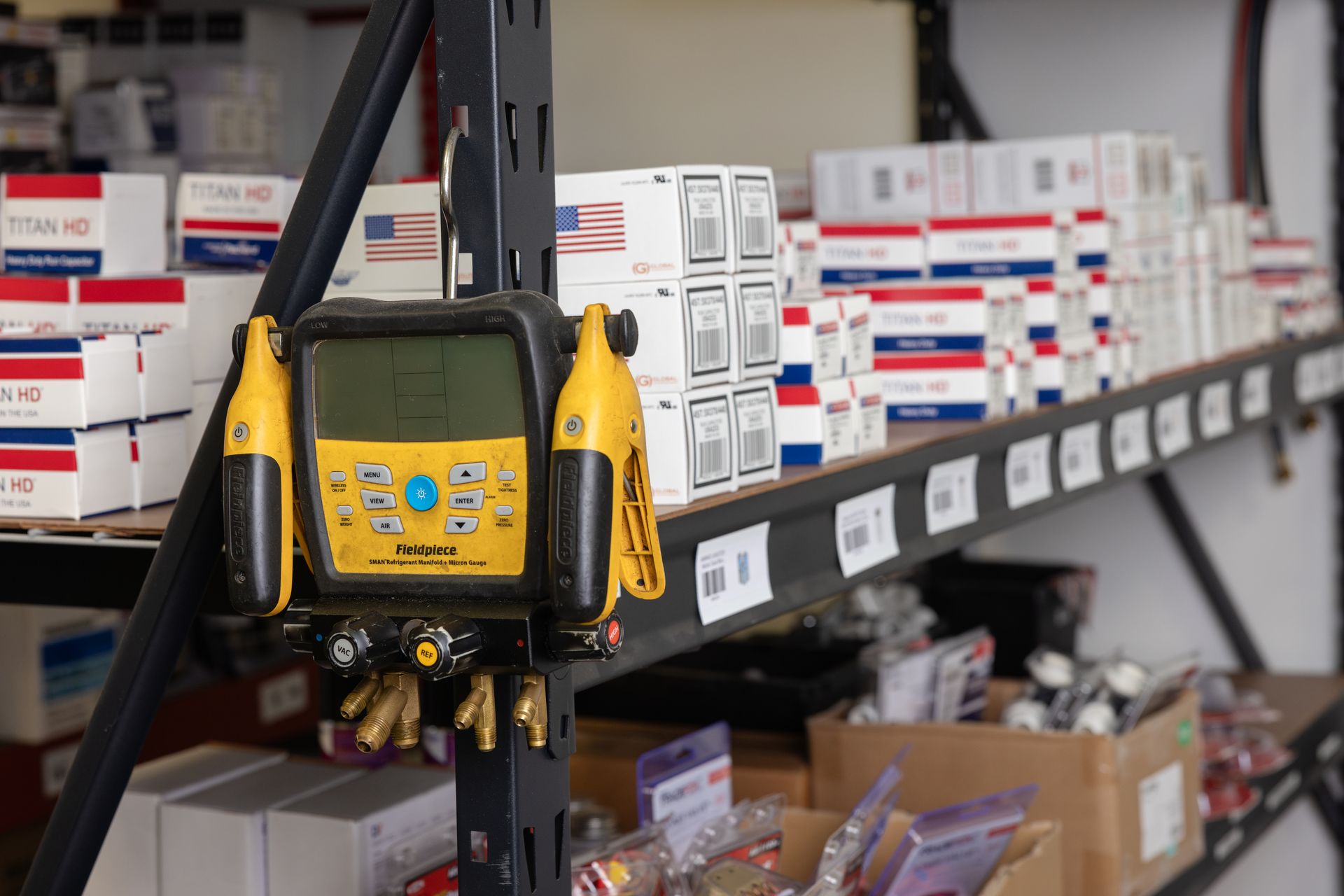 A woman is adjusting a light switch in a living room.
