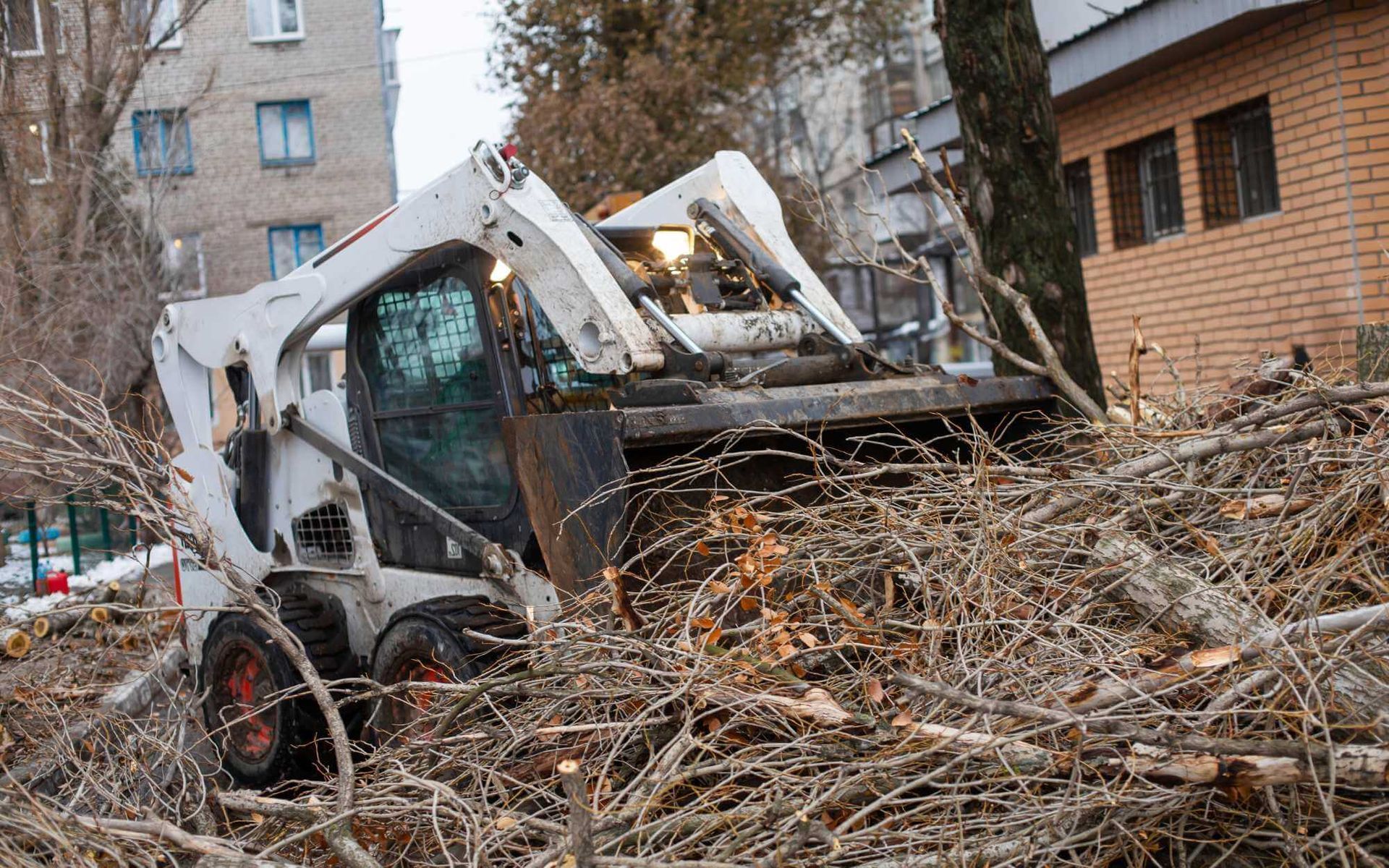 a tractor is being used to remove these fallen trees