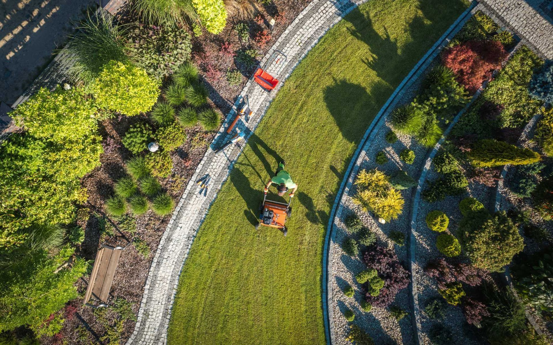 soil aeration being performed in a landscaped yard of a Boca Raton home