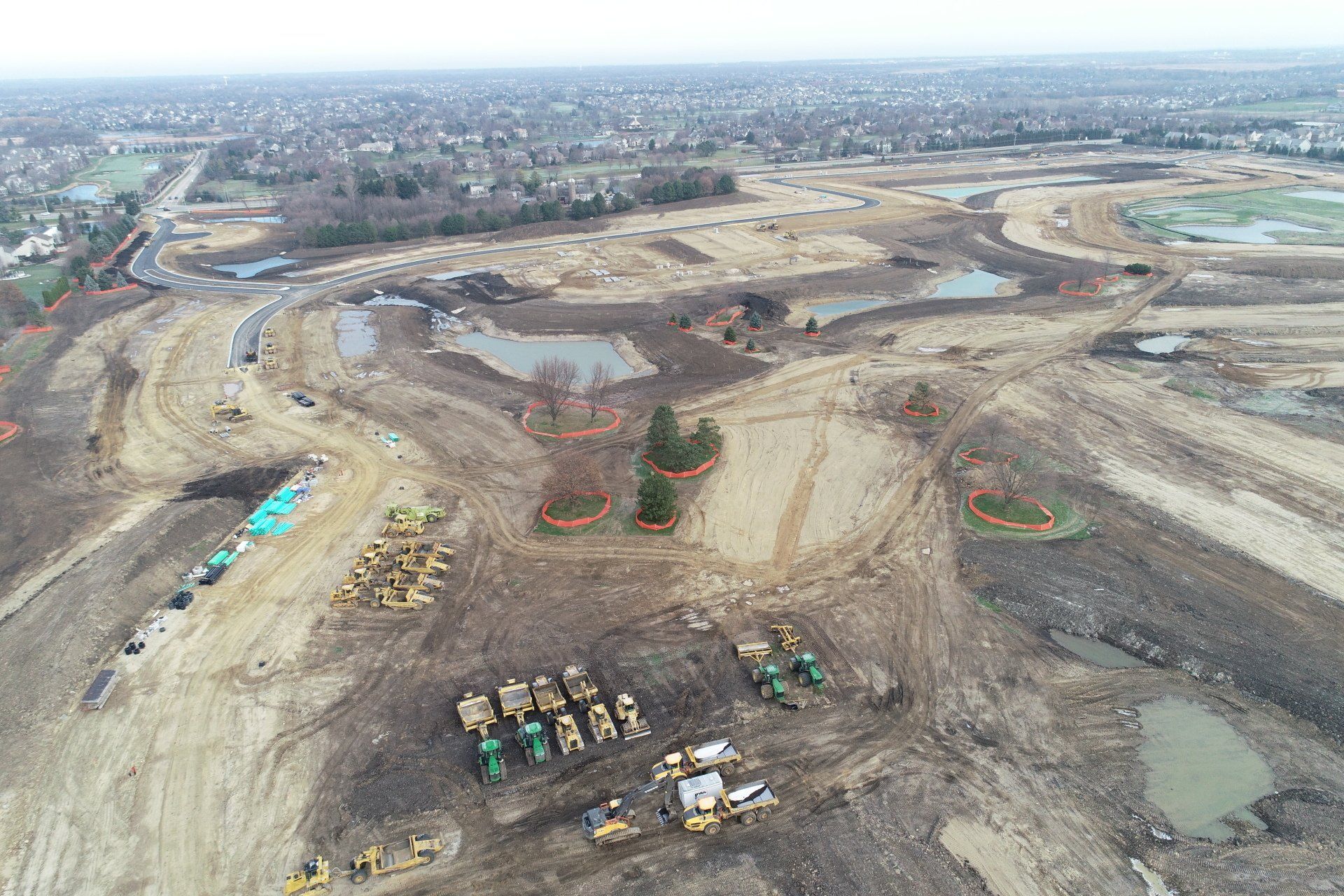 An aerial view of a construction site with a lot of machinery.