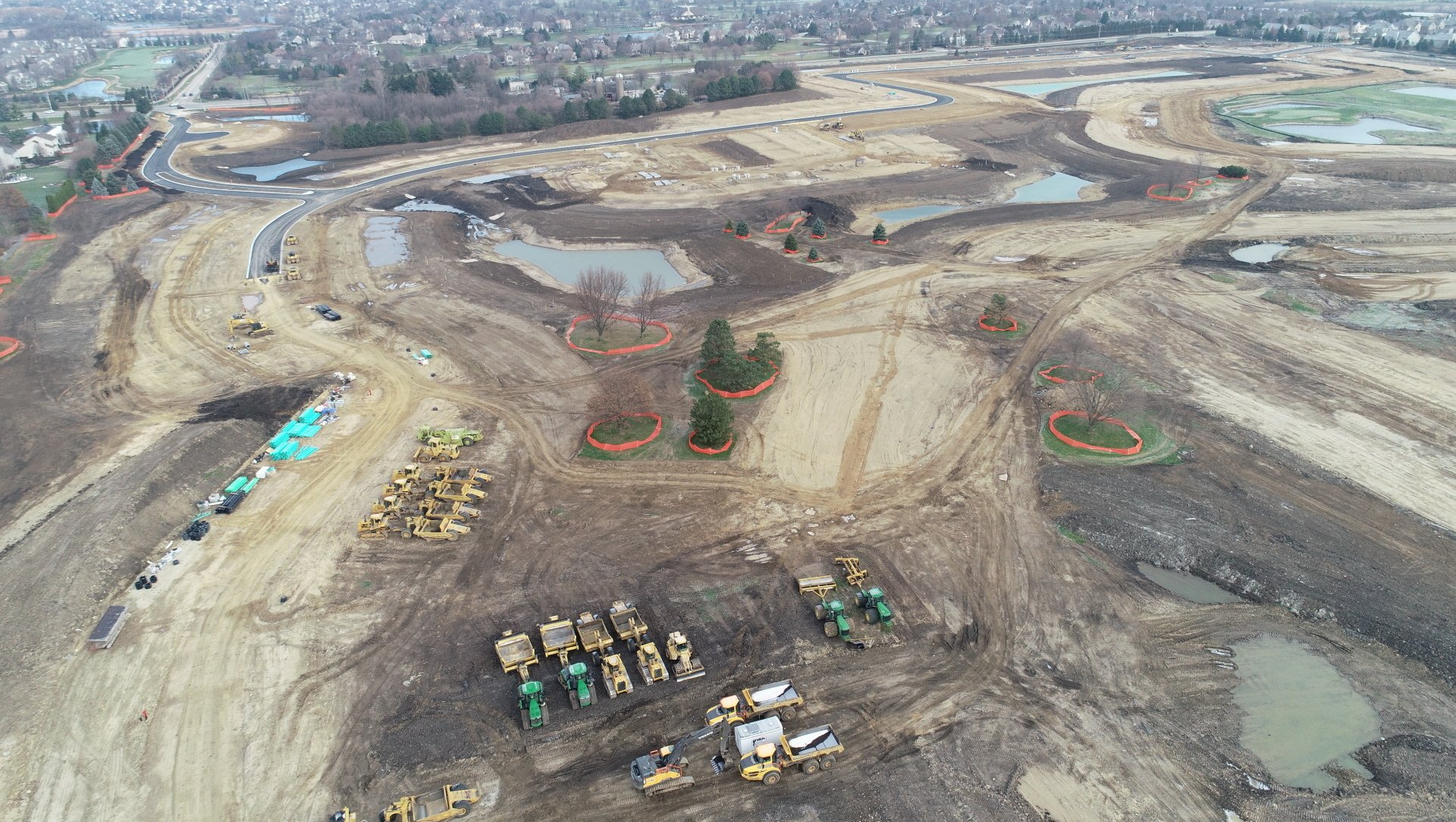 An aerial view of a construction site with a lot of dirt and tractors.