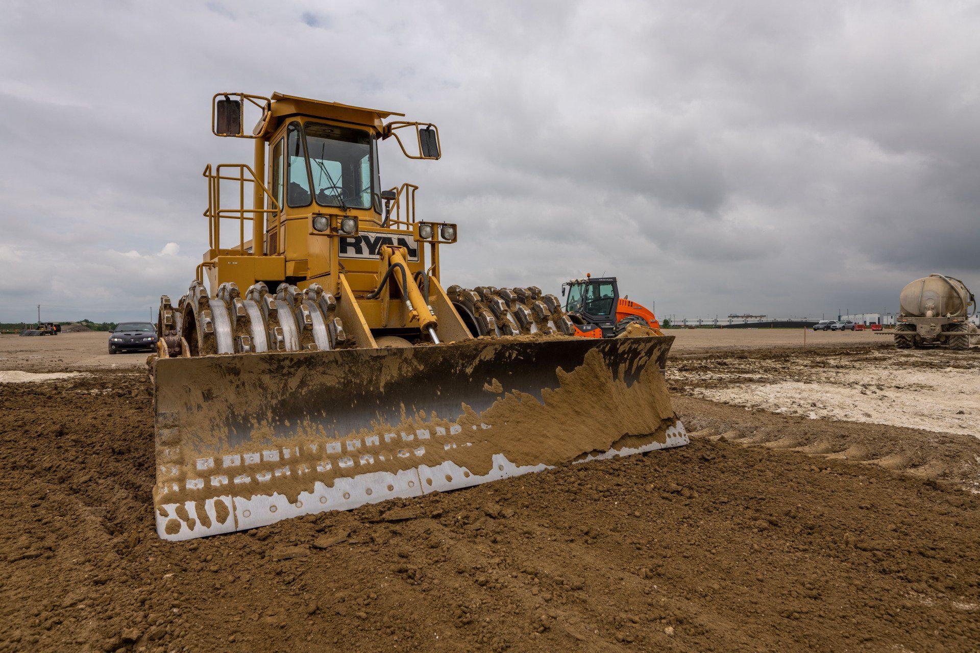 A bulldozer is moving dirt on a construction site.
