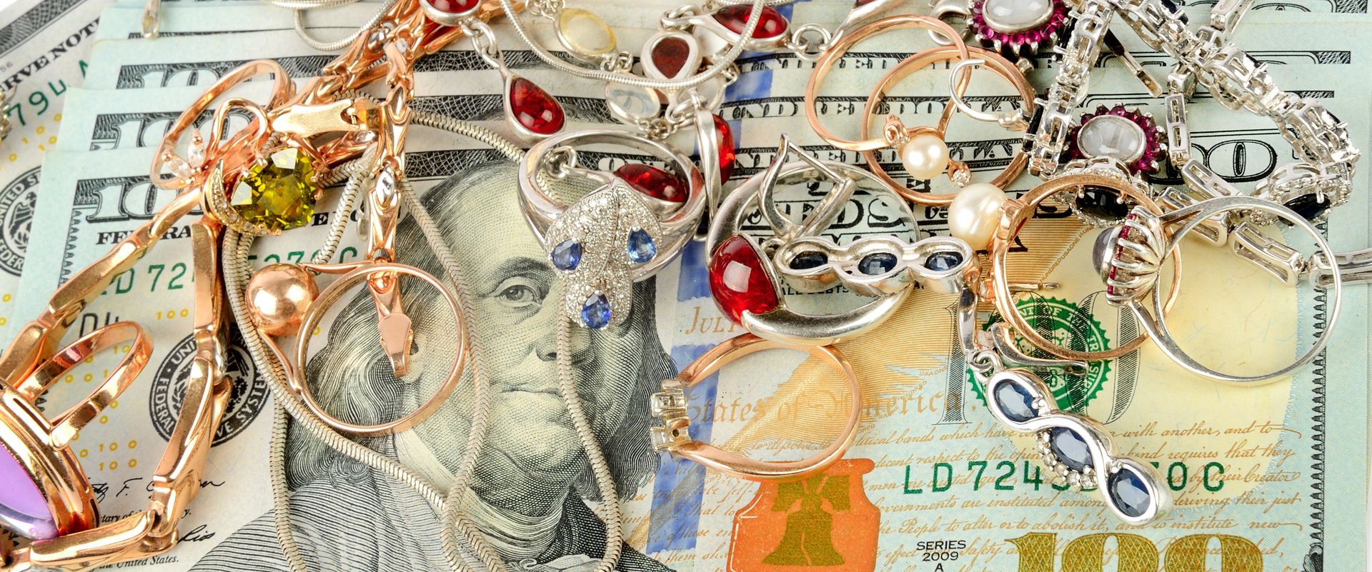 A collection of sparkling jewelry and stacks of cash, highlighting cash for diamonds. A collection of sparkling jewelry and stacks of cash, highlighting cash for diamonds.
