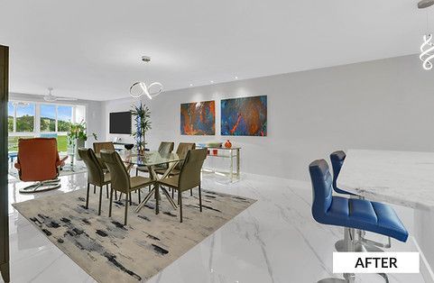 Modern dining room with glass table, gray chairs, art, and bar stools.