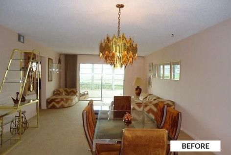 Dining room with gold chandelier, velvet chairs, and a glass-top table.