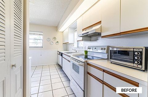 White kitchen with white cabinets, appliances, and tile floor, 