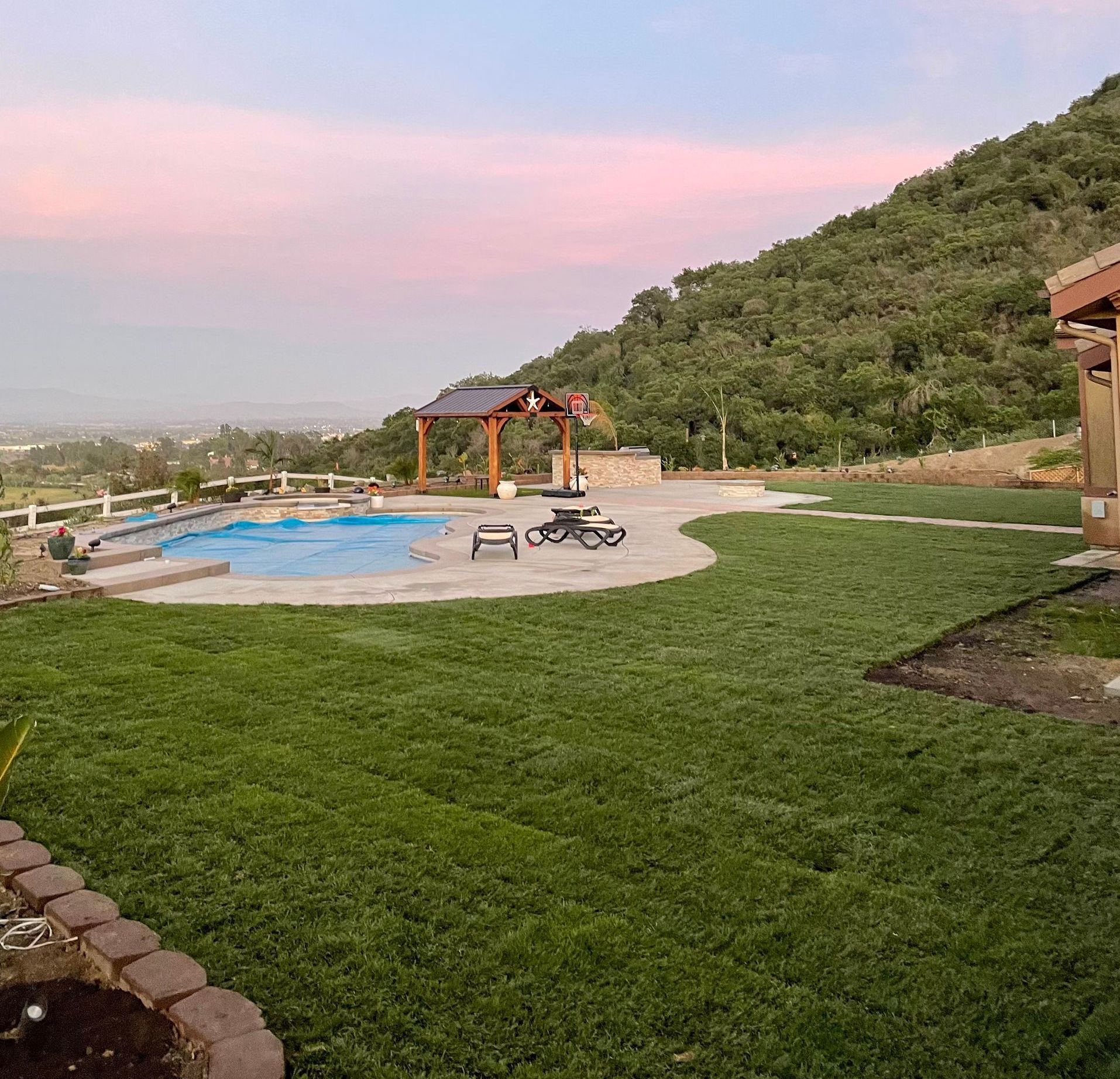 artificial grass installation in back yard