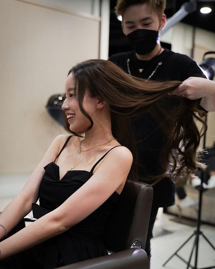 Woman having her hair styled