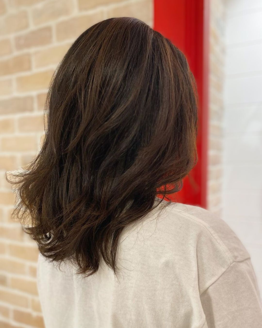 Layered Mid-Length Hair at Kimage Hair Salon