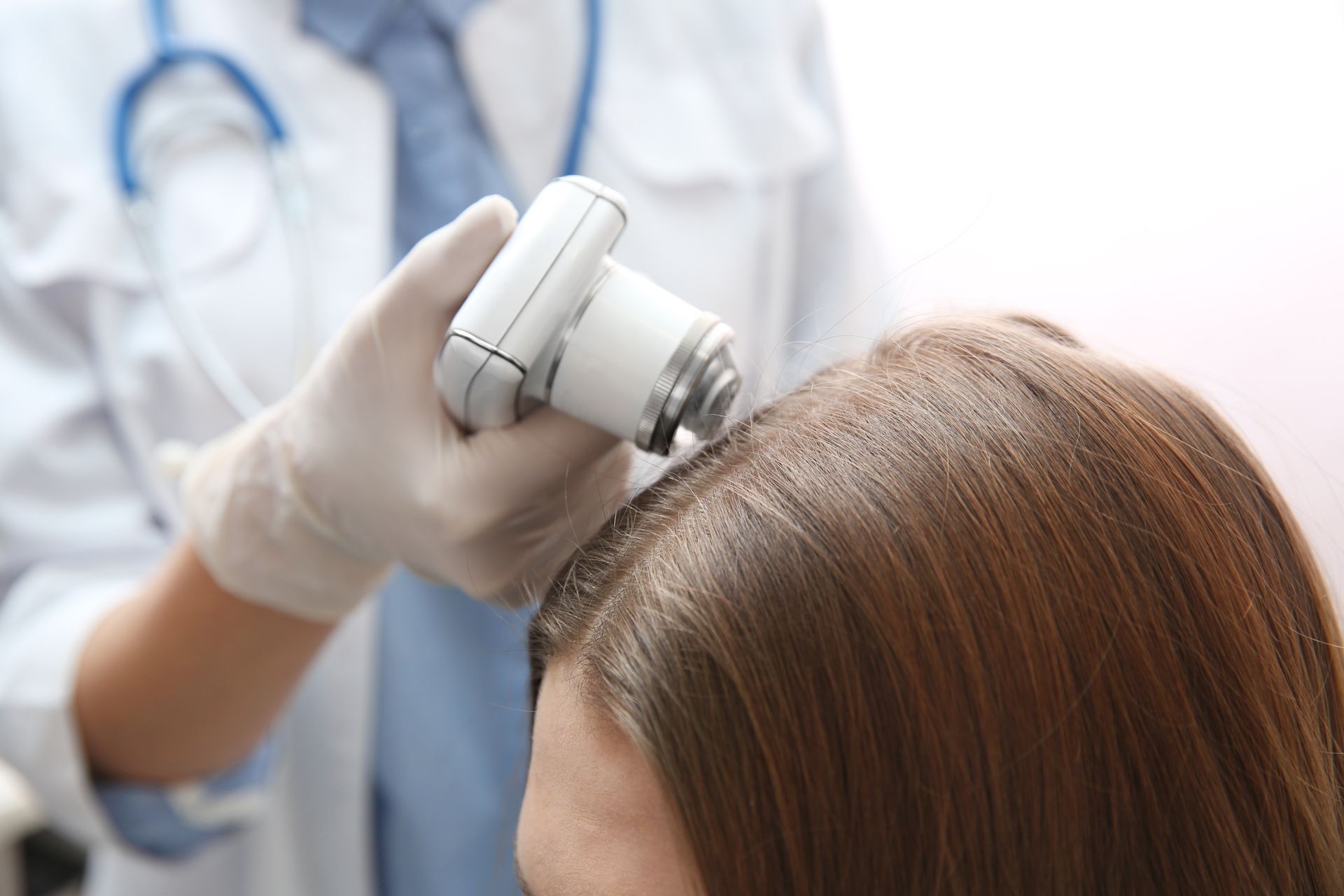 Woman undergoing scalp treatment for hair loss