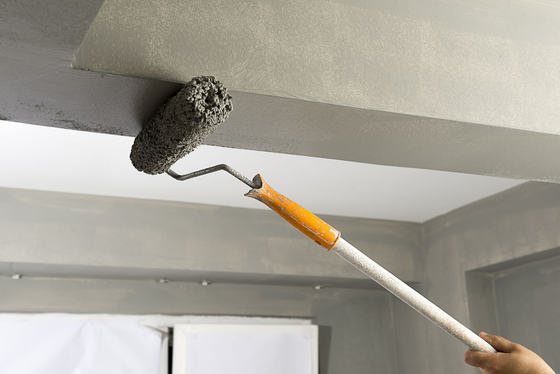 Paint roller on ceiling