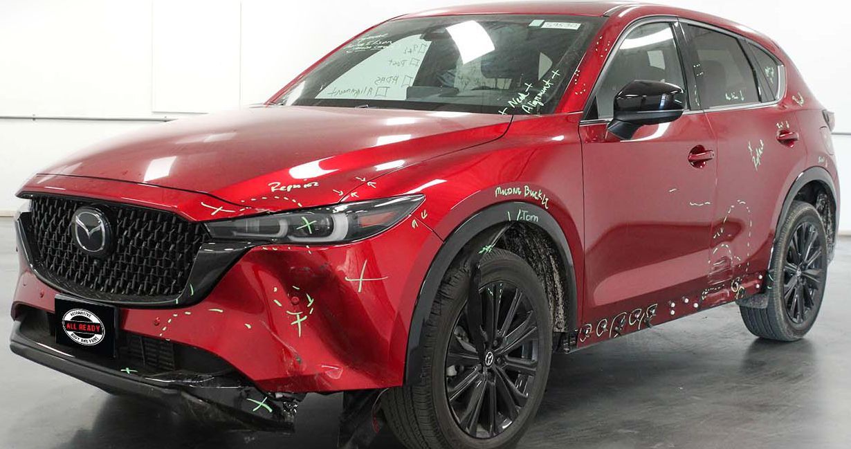 All Ready Auto Body in Austin, TX - before pic - Red Mazda CX-5 SUV with black wheels.