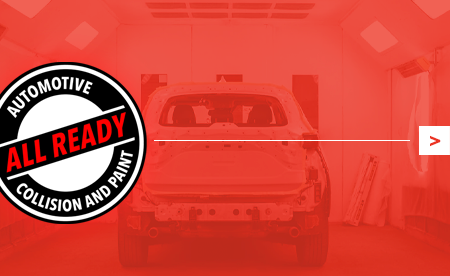 Overhead view of a dark gray roof, with a green and yellow logo featuring a stylized house and the letter