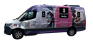 Van with a purple and white wrap; the wrap features the brand’s logo and images of healthcare workers and patients.
