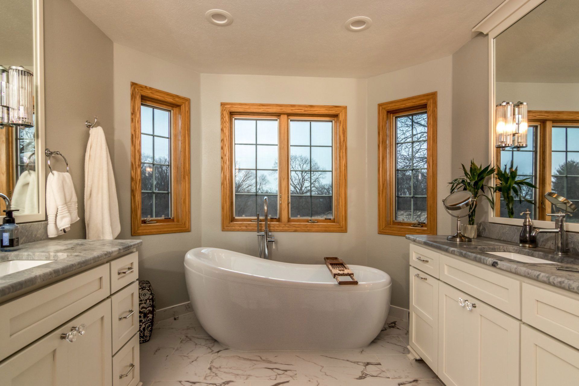 There is a bathtub in the middle of the bathroom.