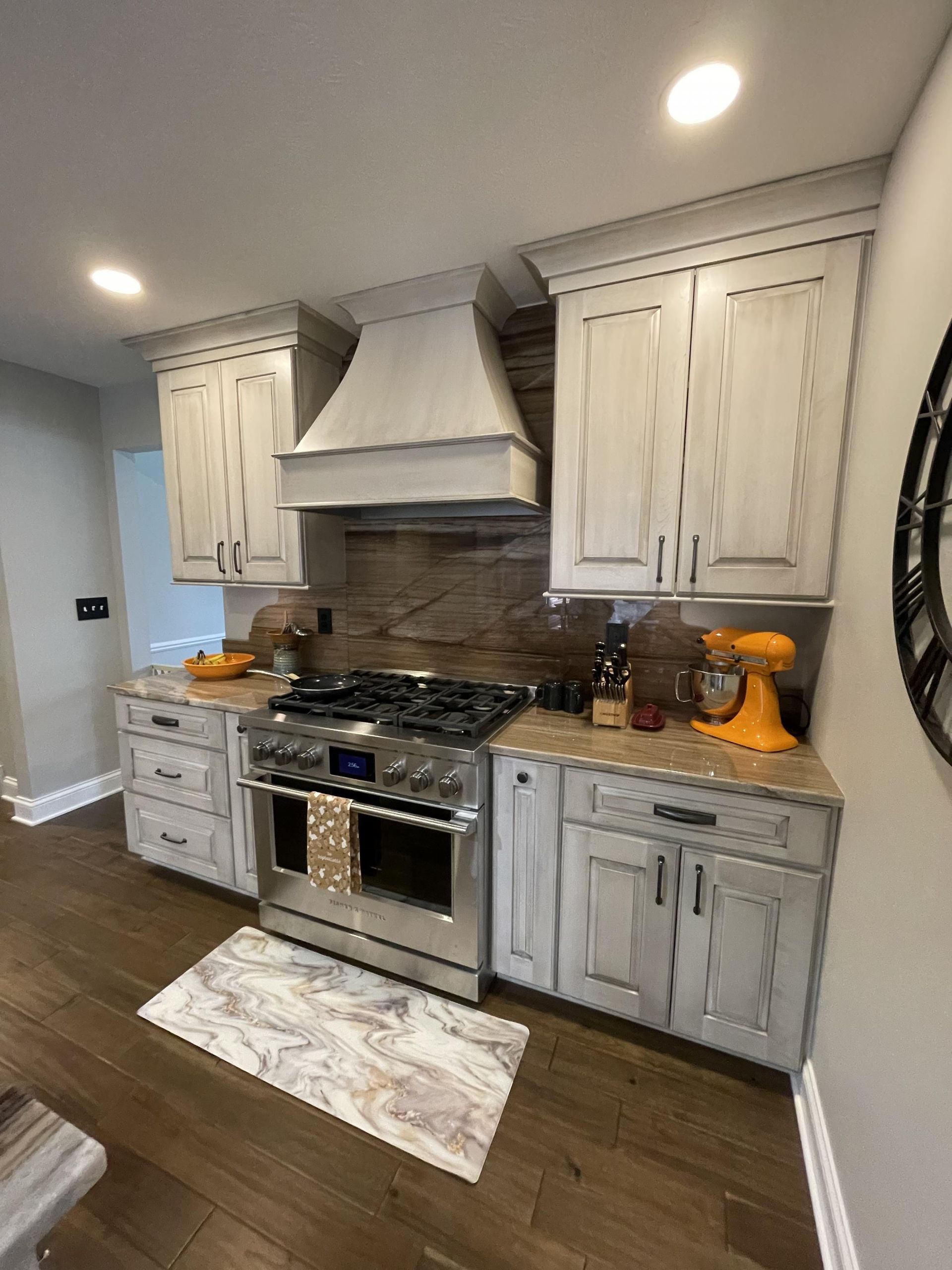 A kitchen with white cabinets and stainless steel appliances.