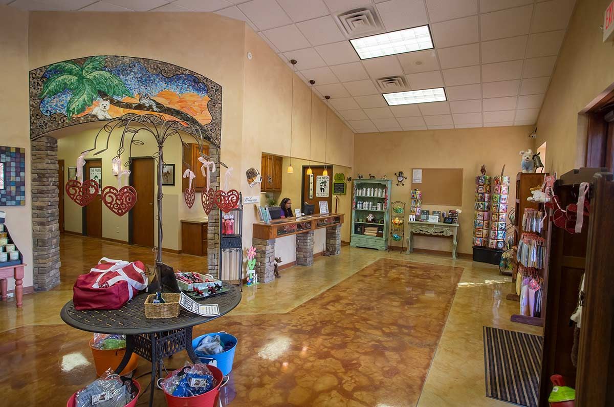 A large room with a table in the middle of it.