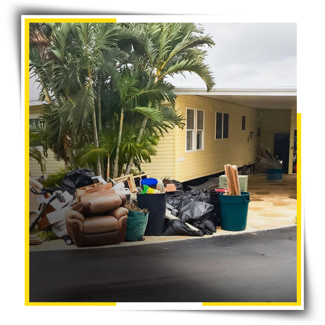 A plie of Garbage in front of a house