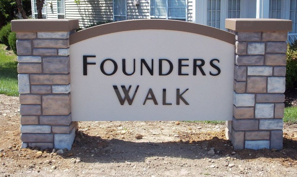 A stone monument sign with the text