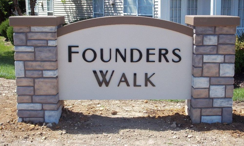 A stone monument sign with the text