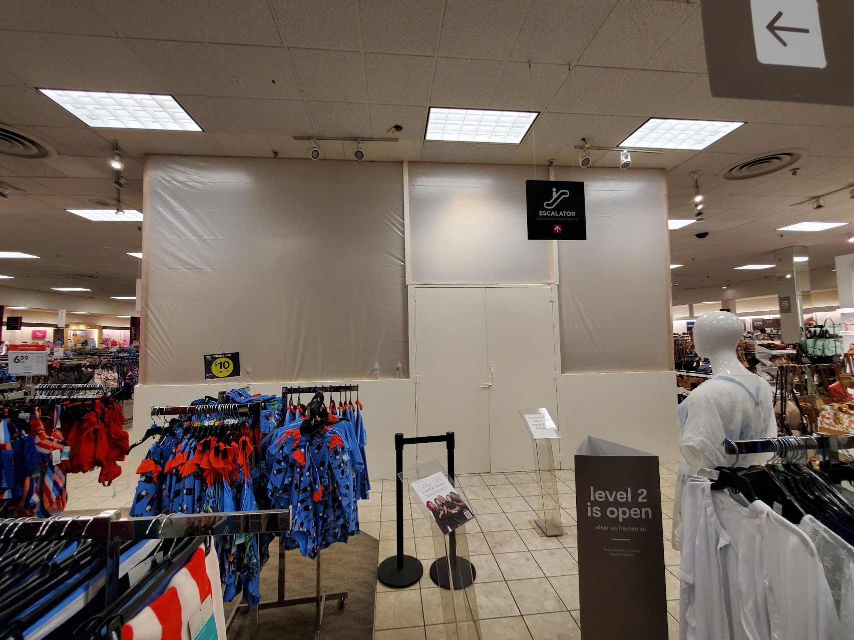 A store with a sign that says level 2 is open