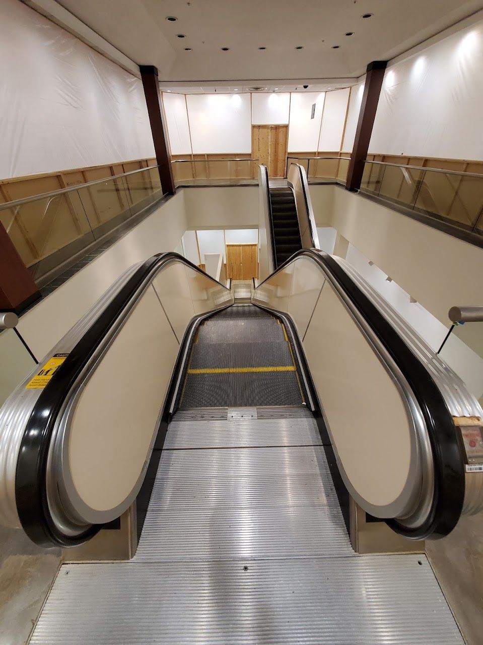 An escalator going up to the second floor of a building