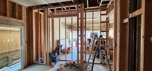 A room with a ladder in the middle of it is being built.