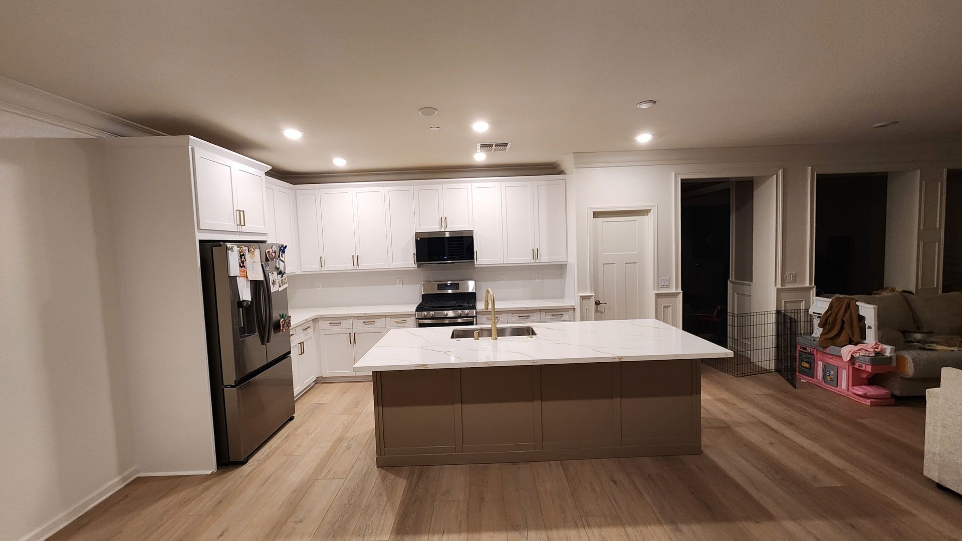 A kitchen with a large island in the middle of the room.