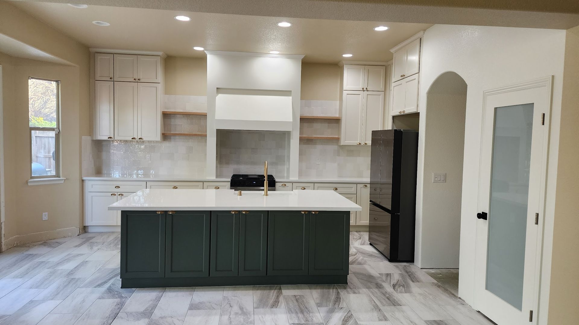 There is a large island in the middle of the kitchen.
