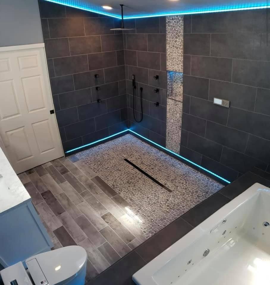 A bathroom with a walk in shower and a bathtub