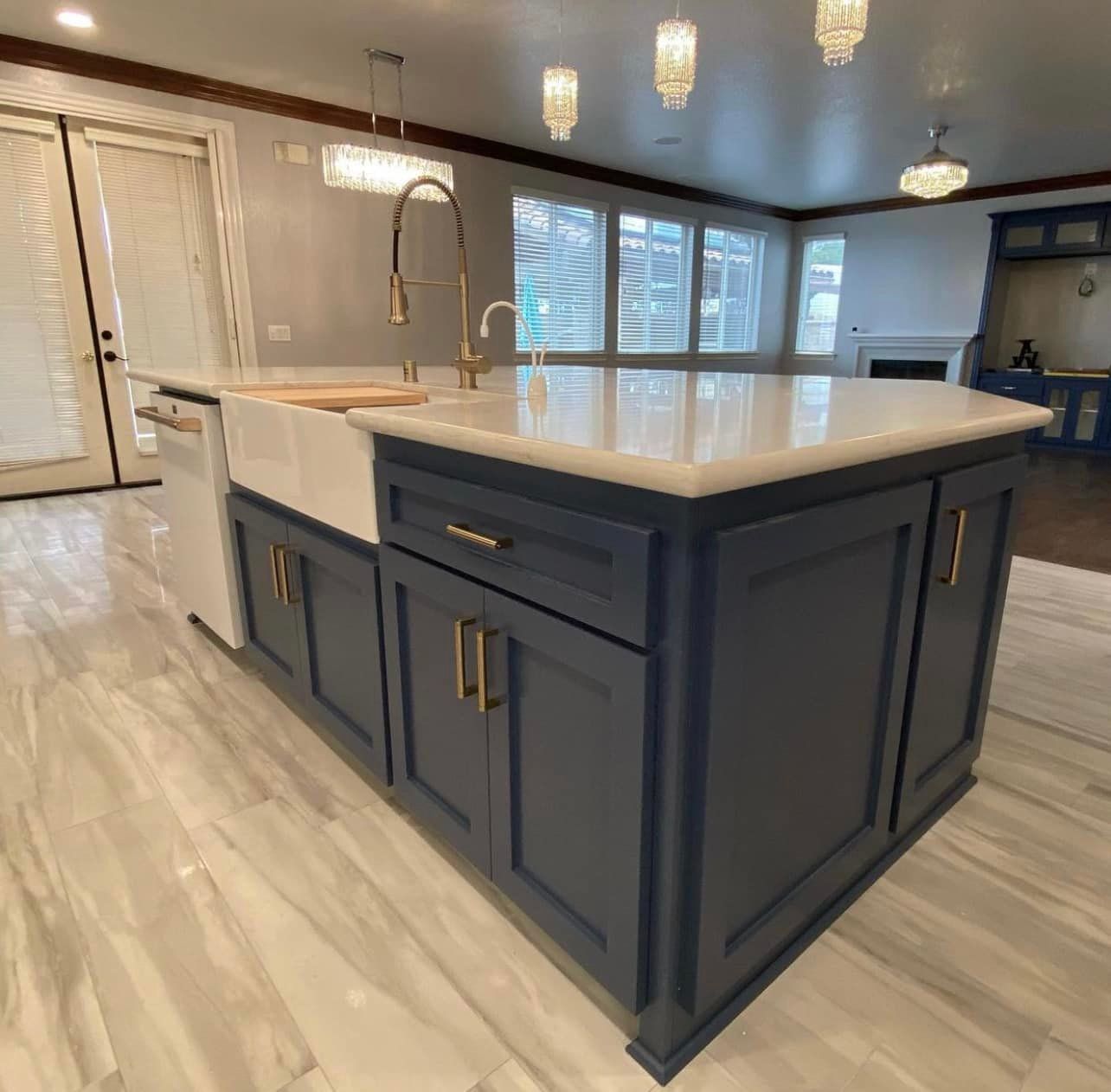 A kitchen with a large island and a sink