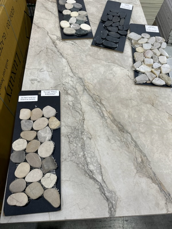 A table with three trays of rocks on it