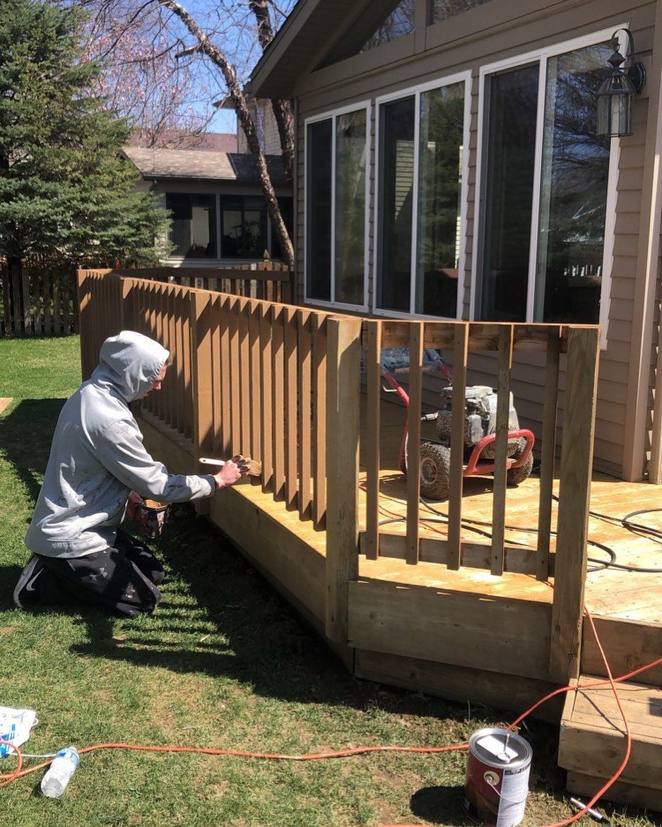 A house with a screened in porch and a deck