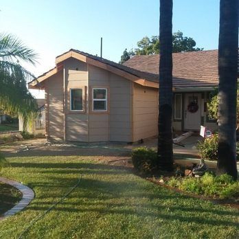 A house with a palm tree in front of it