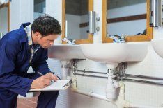 Plumber Writing Notes — Wesley Chapel, FL — Tri-Care Services Inc