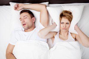 husband snoring and woman disturbed