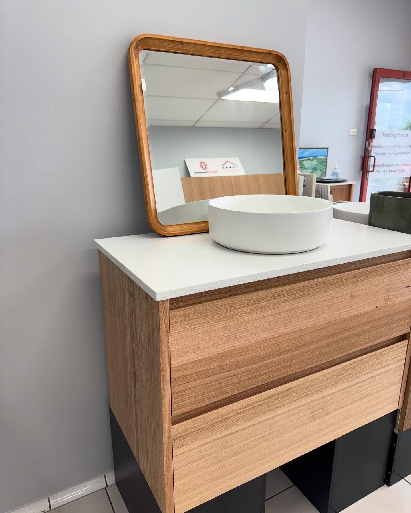 Modern Bathroom with A Round Mirror — Lukas Joinery in Newcastle, NSW