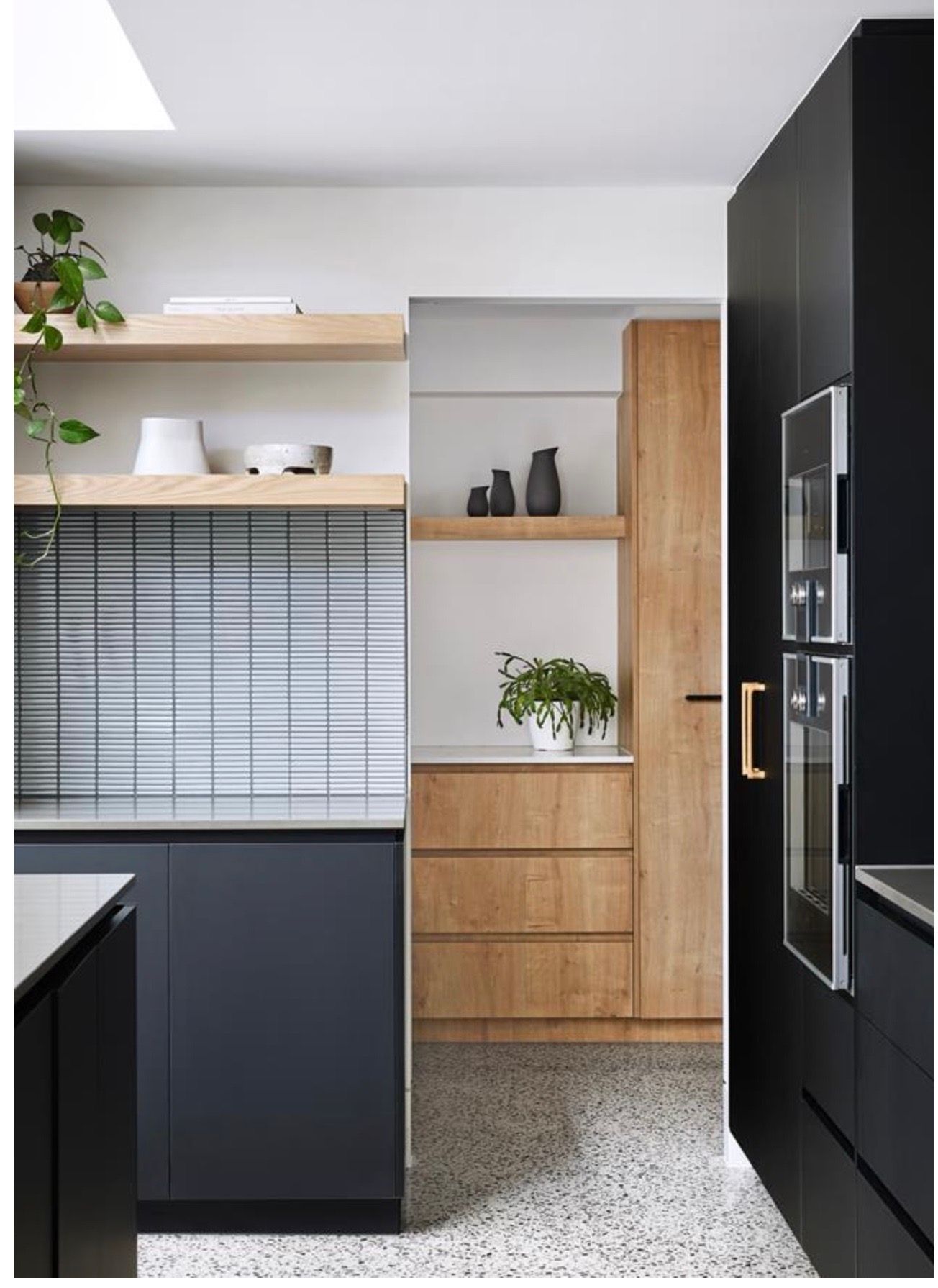 Modern Kitchen with Black and Wood Cabinets — Lukas Joinery in Lake Macquarie, NSW