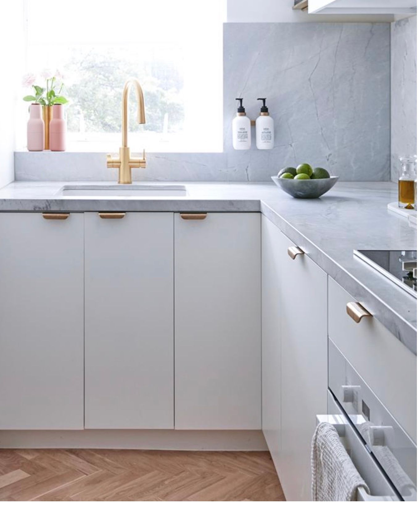 Modern White Kitchen with Gold Faucet — Lukas Joinery in Cessnock, NSW