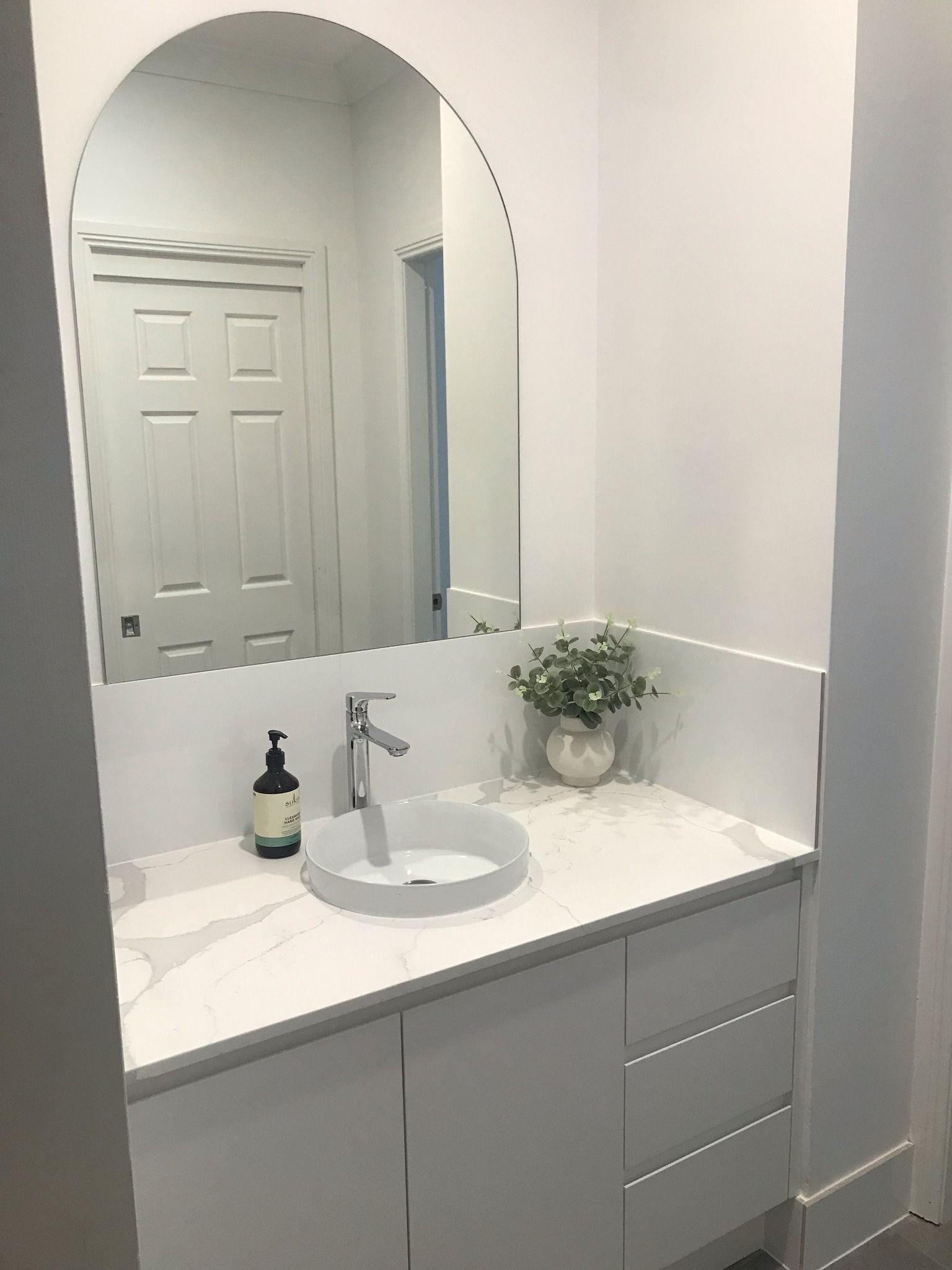 White Modern Bathroom with Arched Mirror — Lukas Joinery in Newcastle, NSW