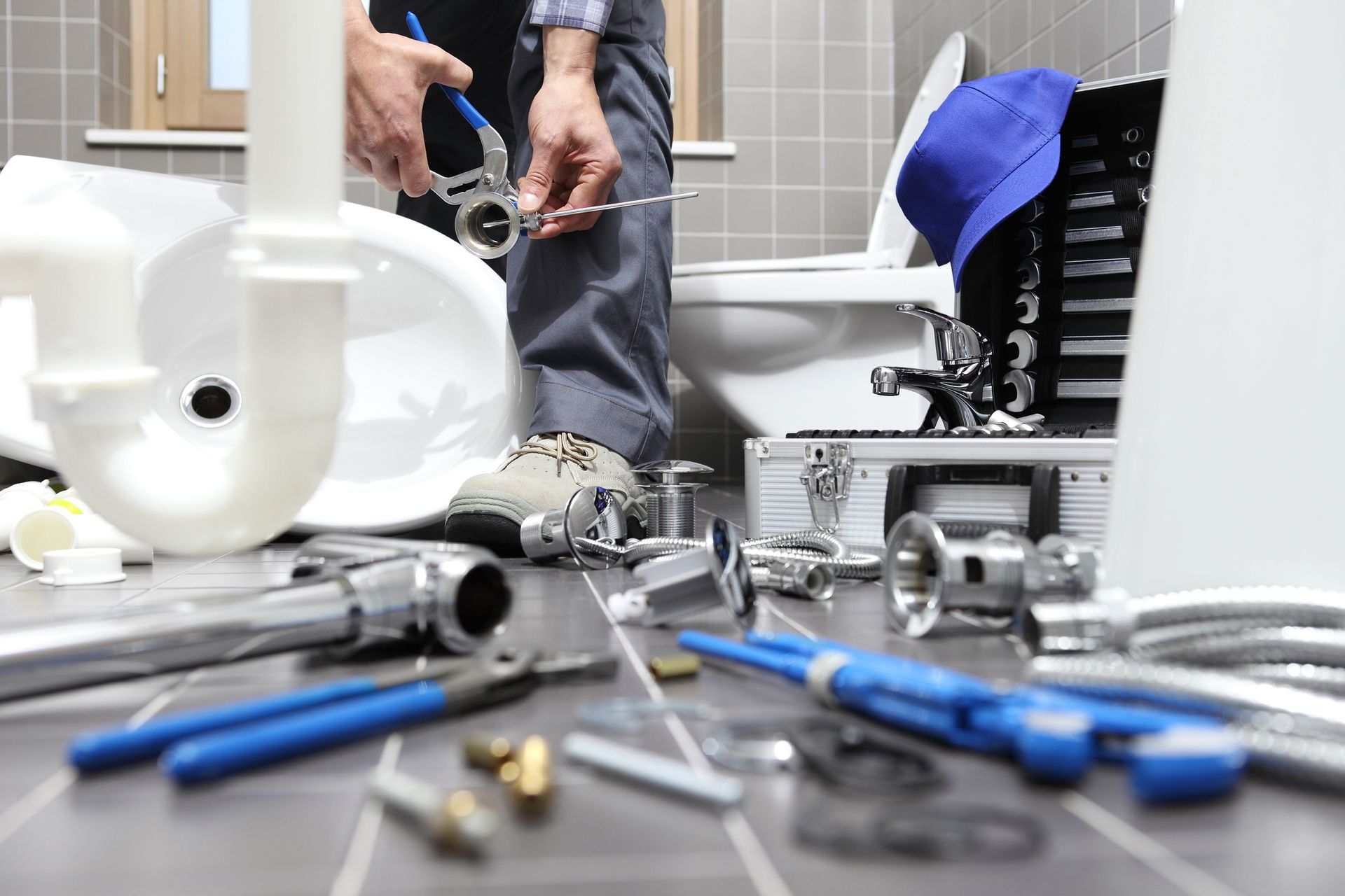 Plumber at Work in a Bathroom | Canberra, ACT | Plumbworks