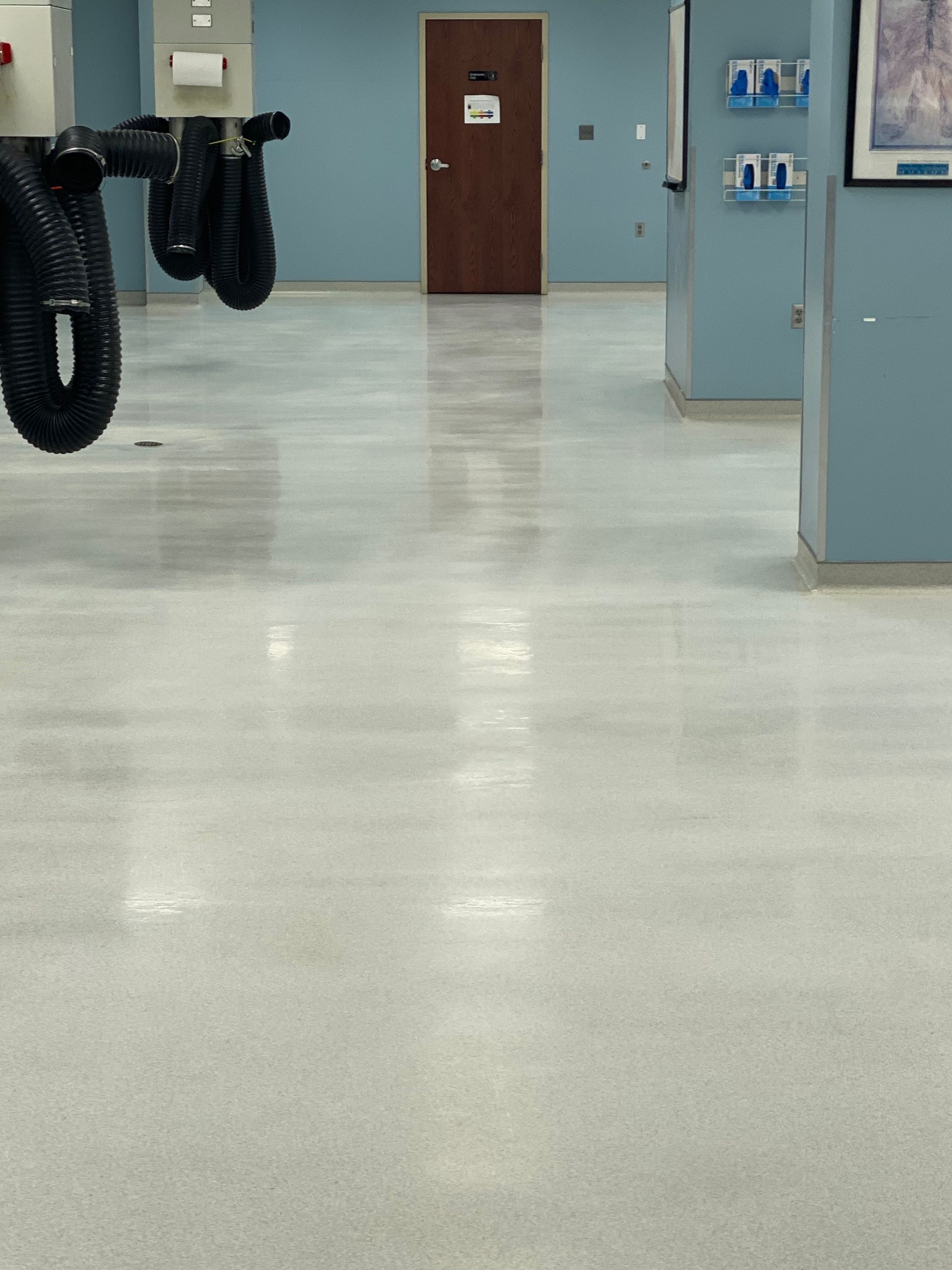 A room with a white floor and blue walls
