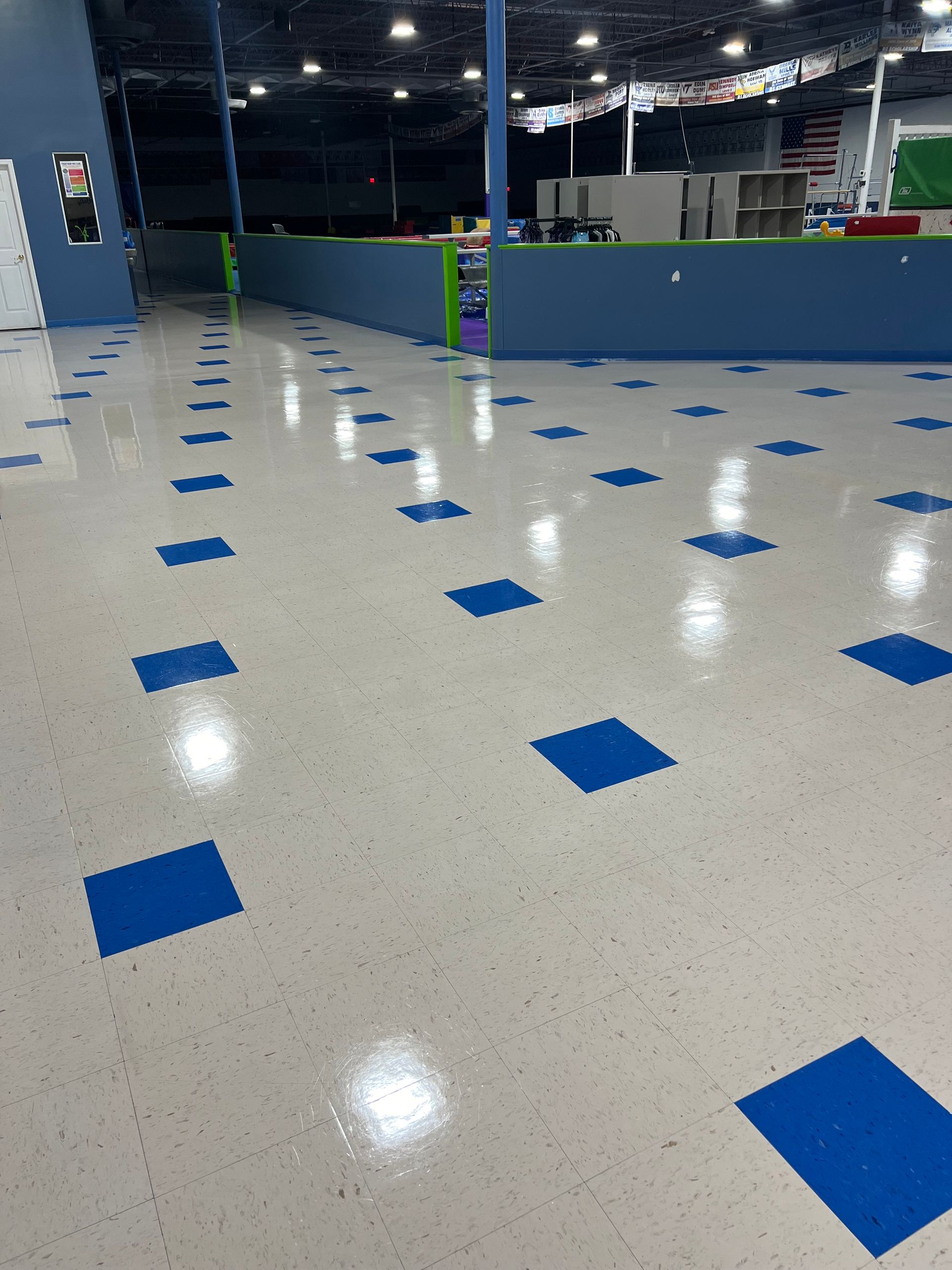 A white floor with blue squares on it.