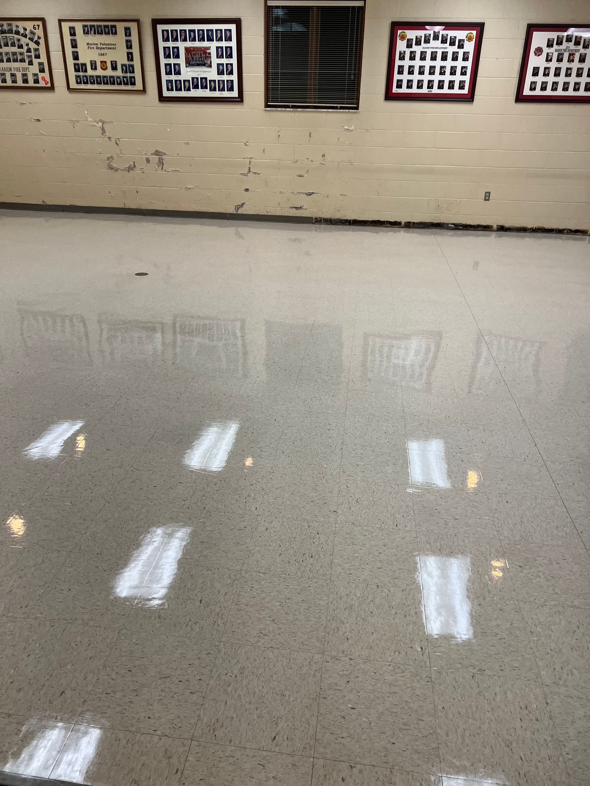 A hallway with a lot of pictures on the wall.