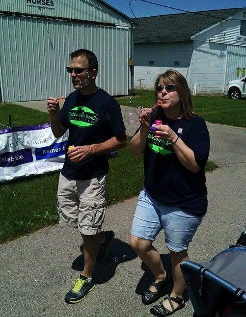 Couple Running While Blowing Bubbles — Hudsonville, MI — Hudsonville Family Dentistry