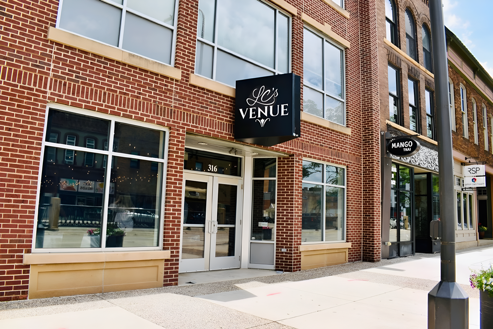 Exterior of a brick building with the sign 