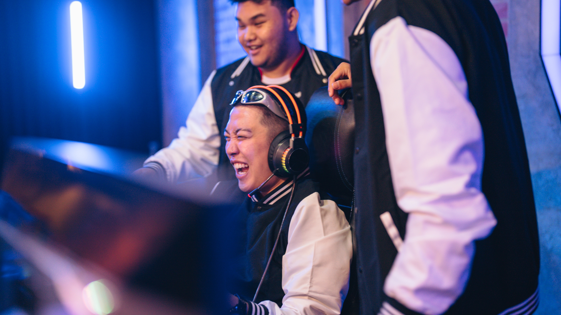 A group of young men are playing a video game together.