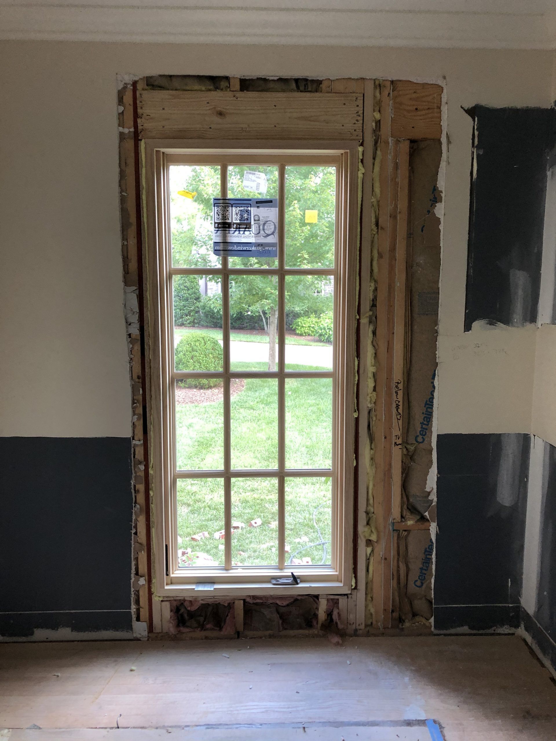 A window in a room that is being remodeled