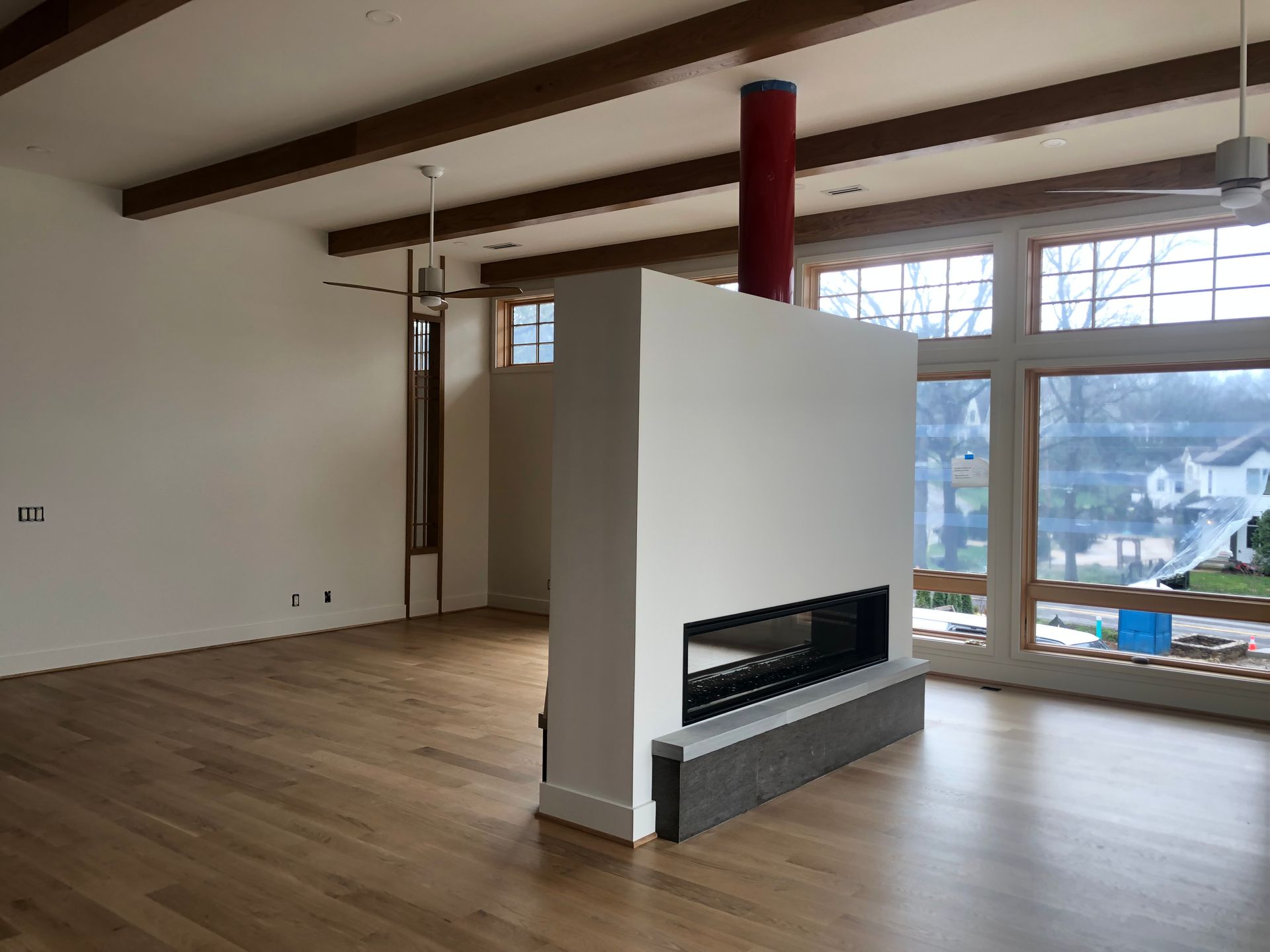 There is a fireplace in the middle of the room.