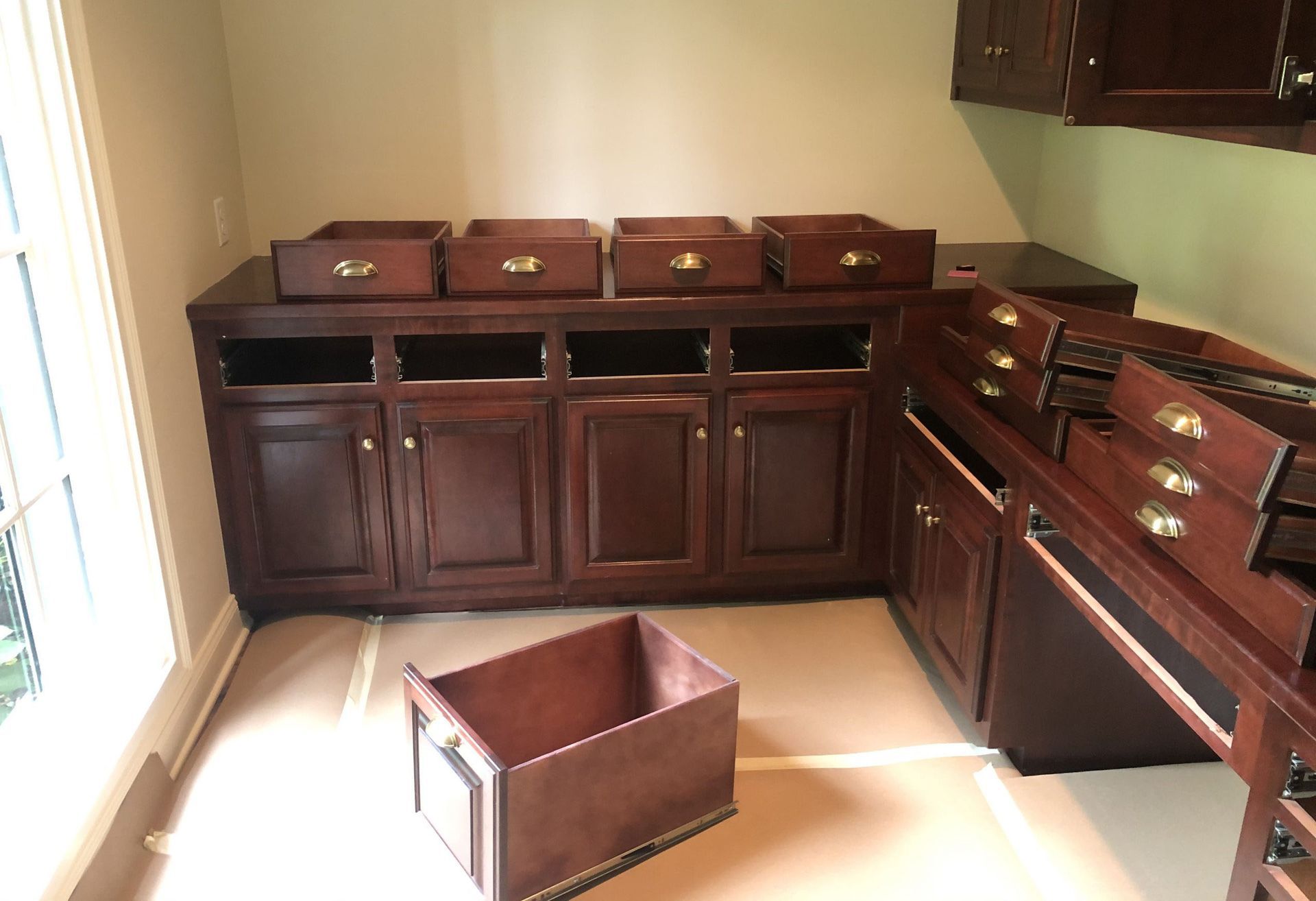 A room with a lot of drawers and cabinets